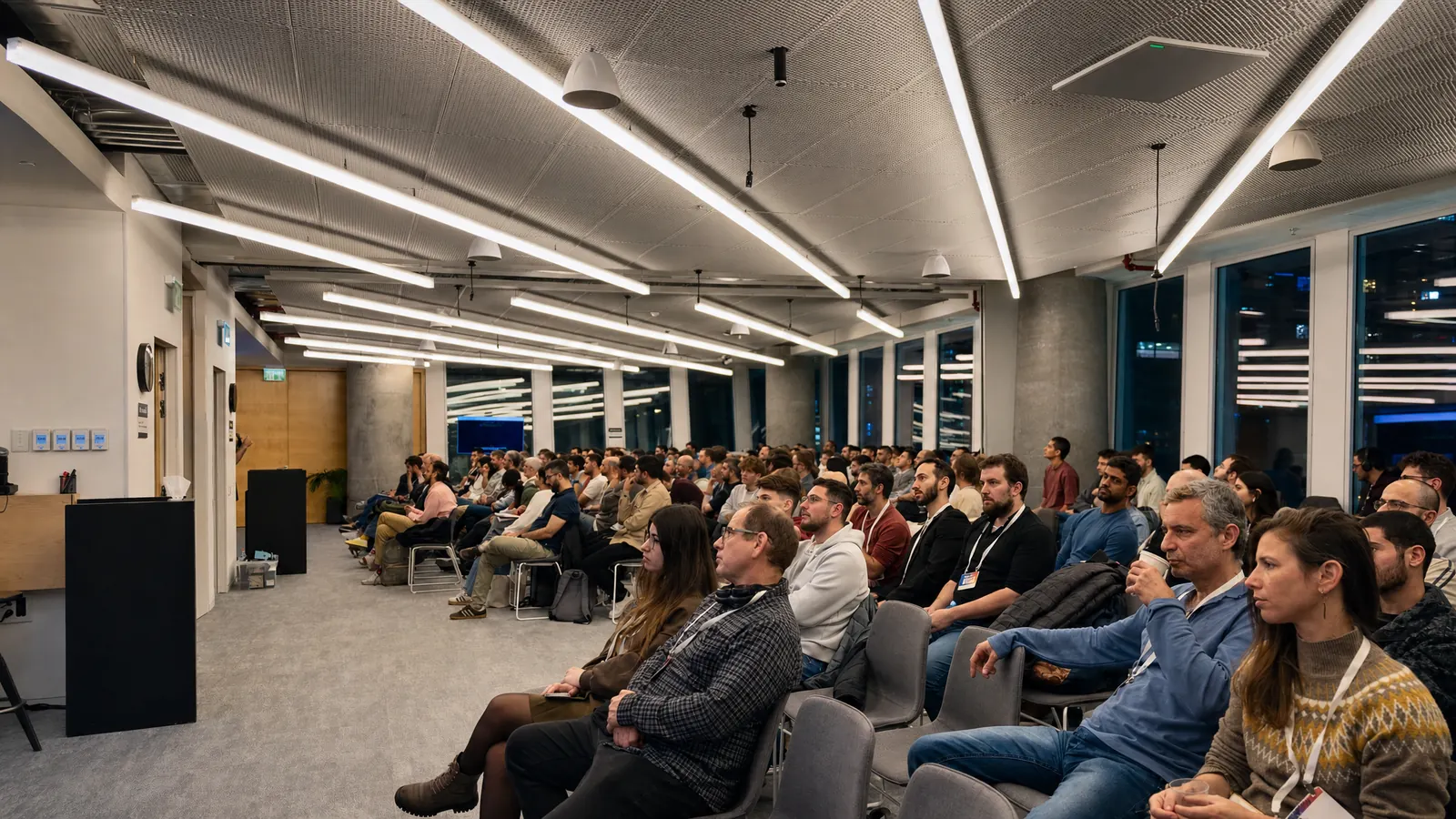 Developers listening to a talk at an Israel MongoDB Community meetup